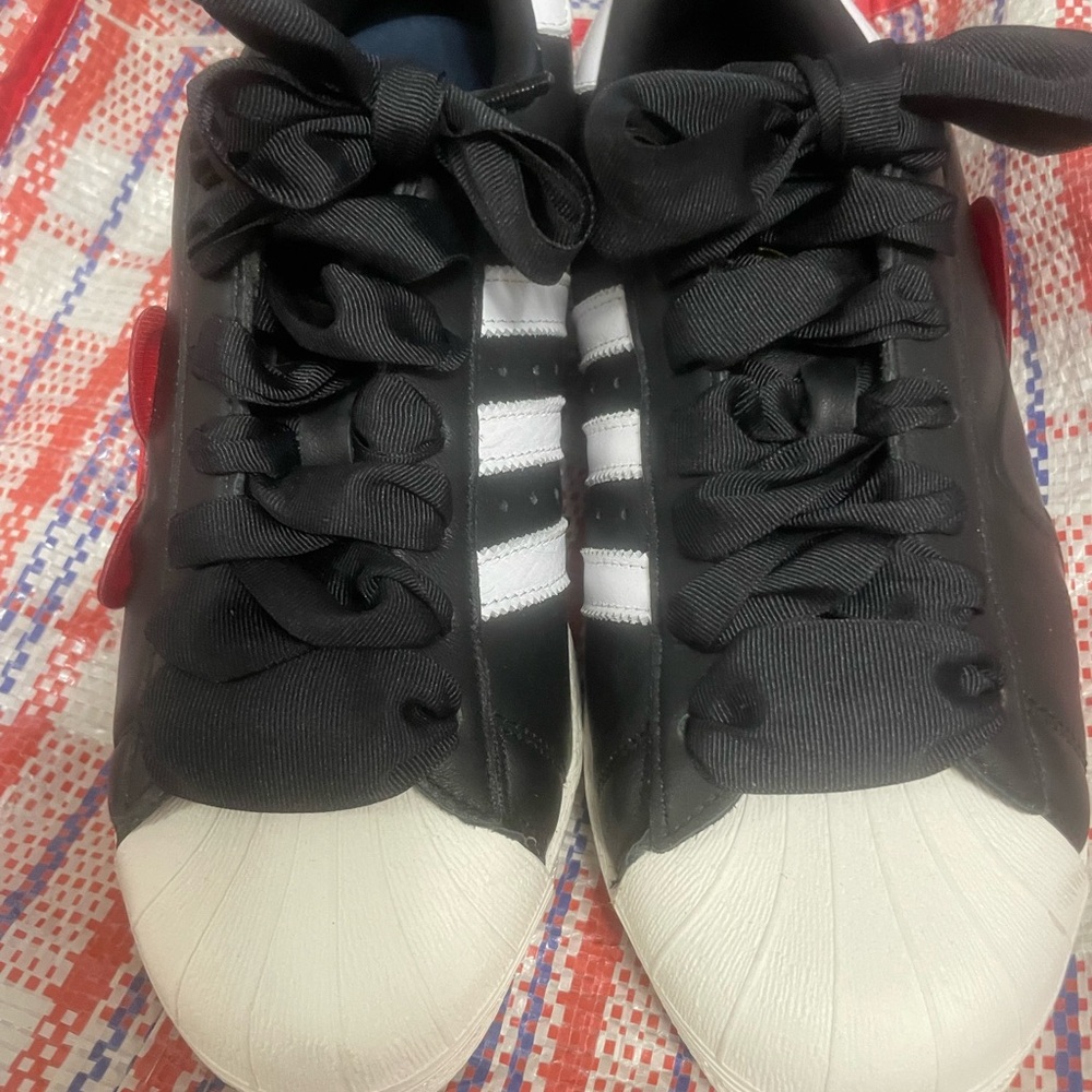 Hello Kitty Black & White Adidas . These run more like an 11 to 11 1/2